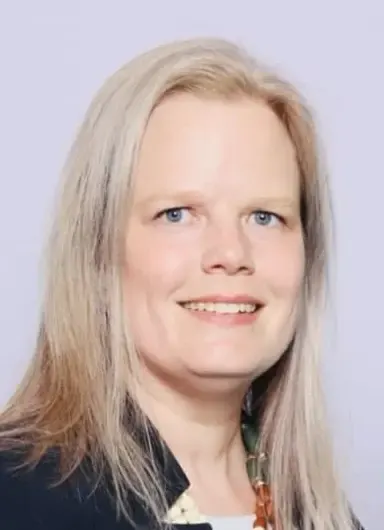 A woman with blonde hair and blue eyes