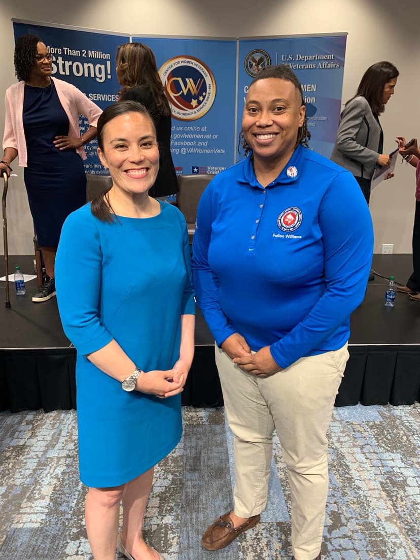 A couple of people standing next to each other