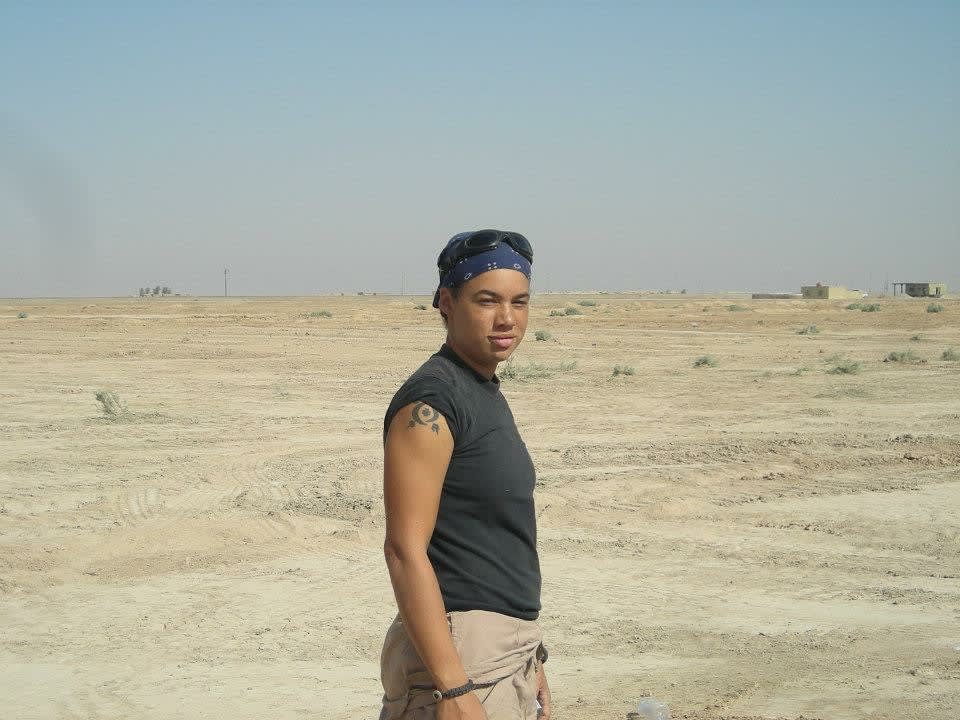 A man standing in the middle of a desert